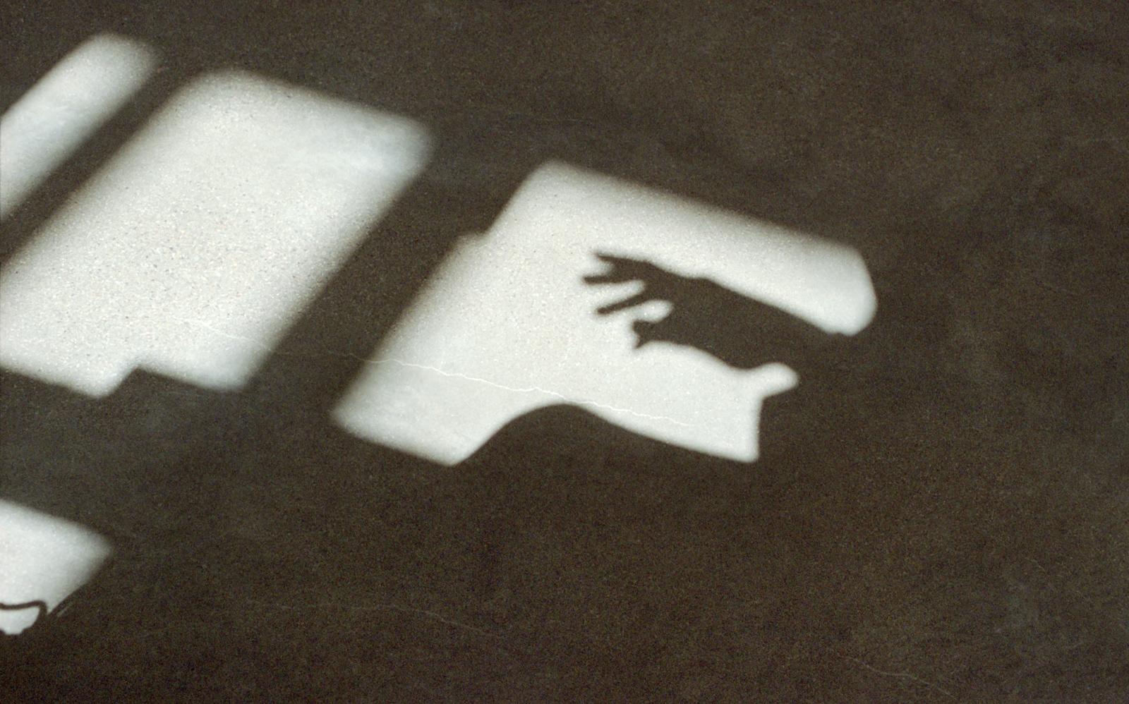 A shadow of a hand.
