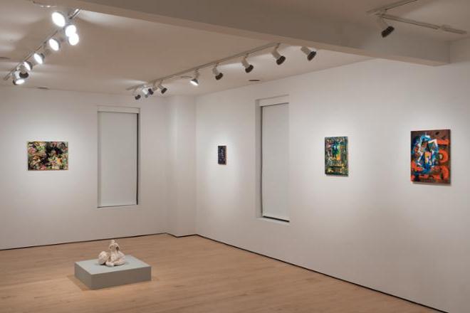 different corner of gallery space filled with sculptures and paintings